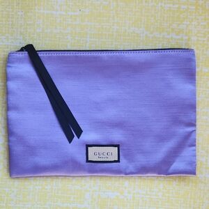 Gucci lavender satin zip clutch with black ribbon pull